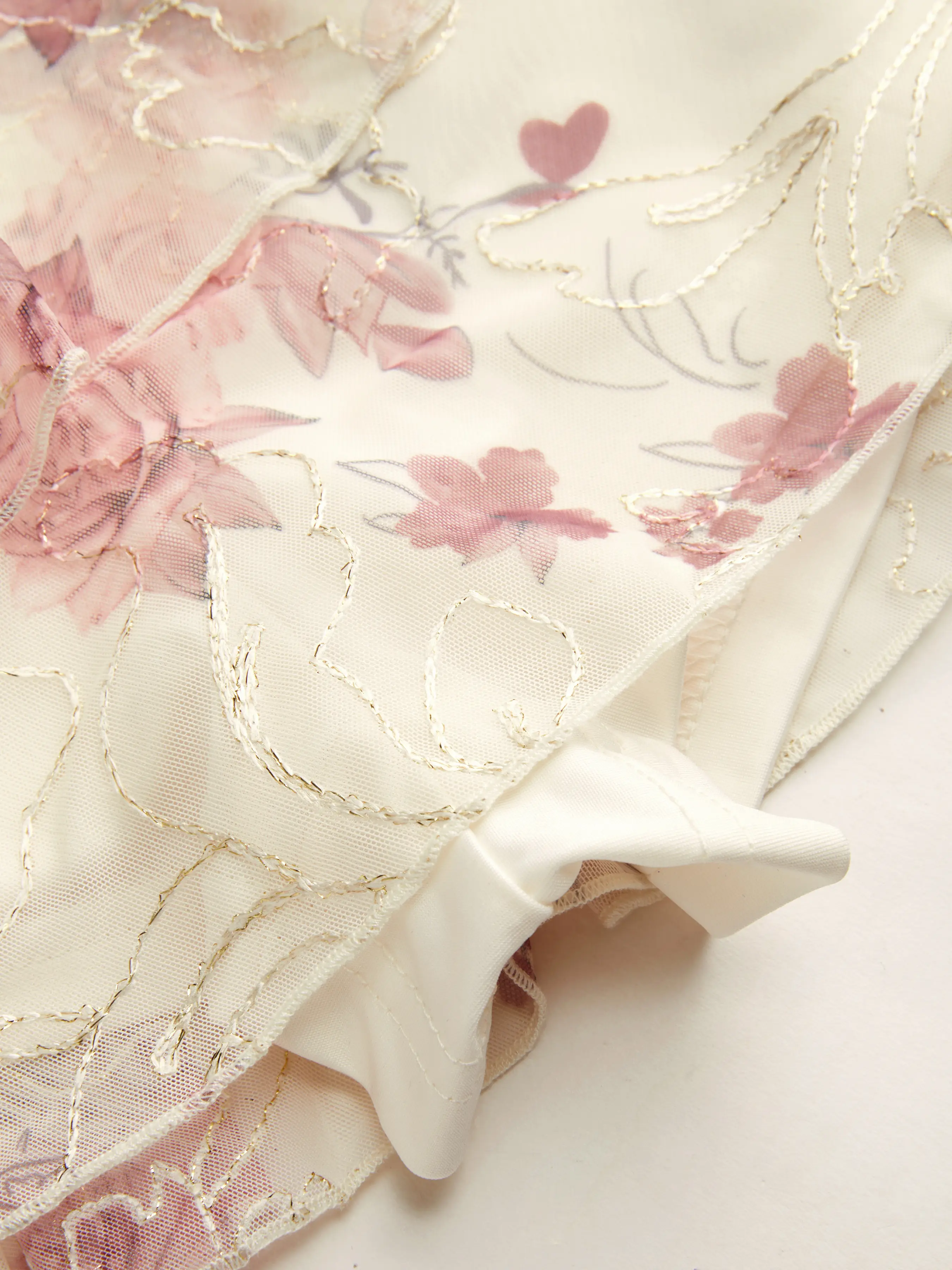 10045-mesh-mid-rise-floral-asymmetrical-ruffle-hem-mini-skirt-1.webp