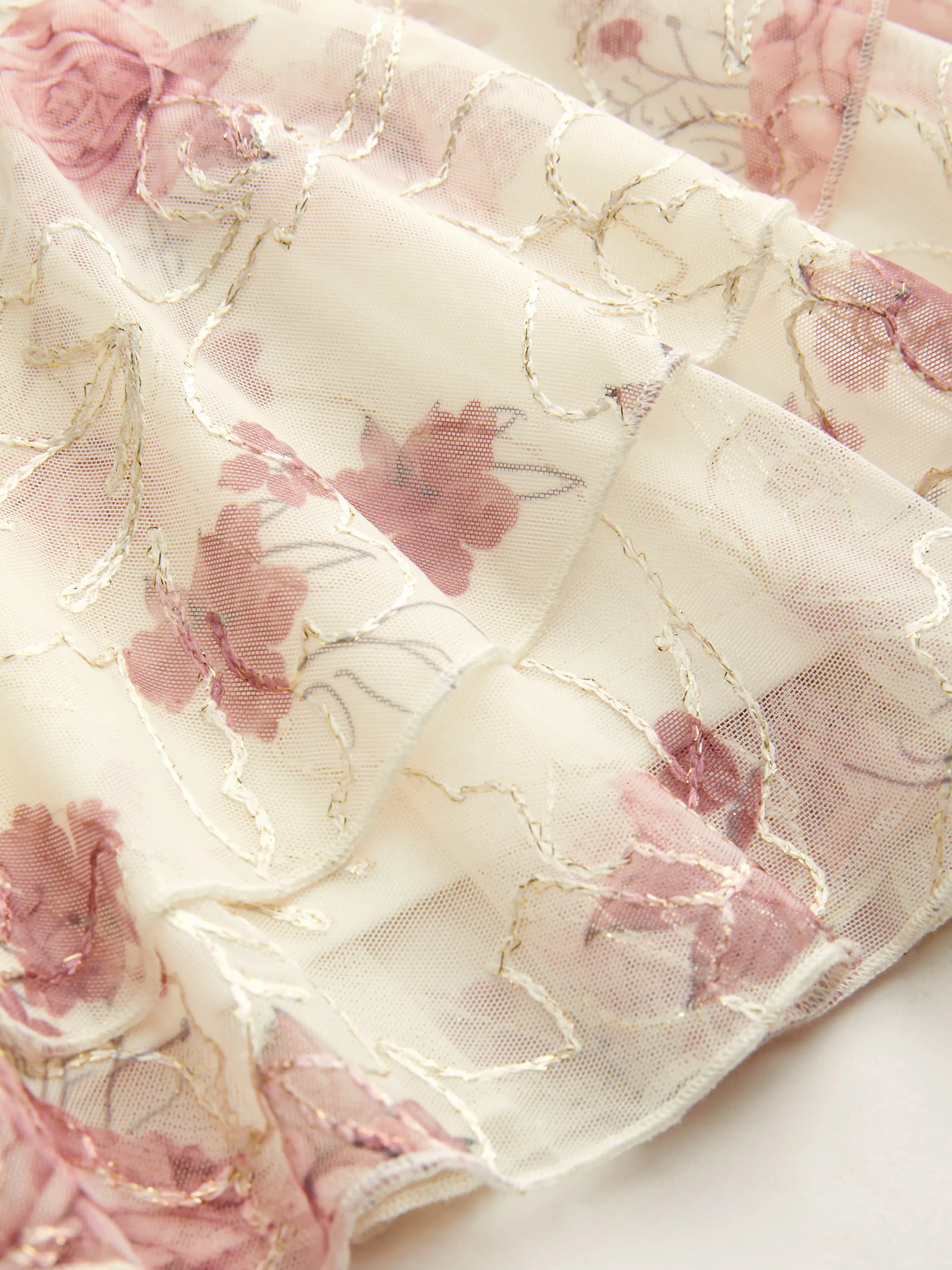 10045-mesh-mid-rise-floral-asymmetrical-ruffle-hem-mini-skirt-1.webp