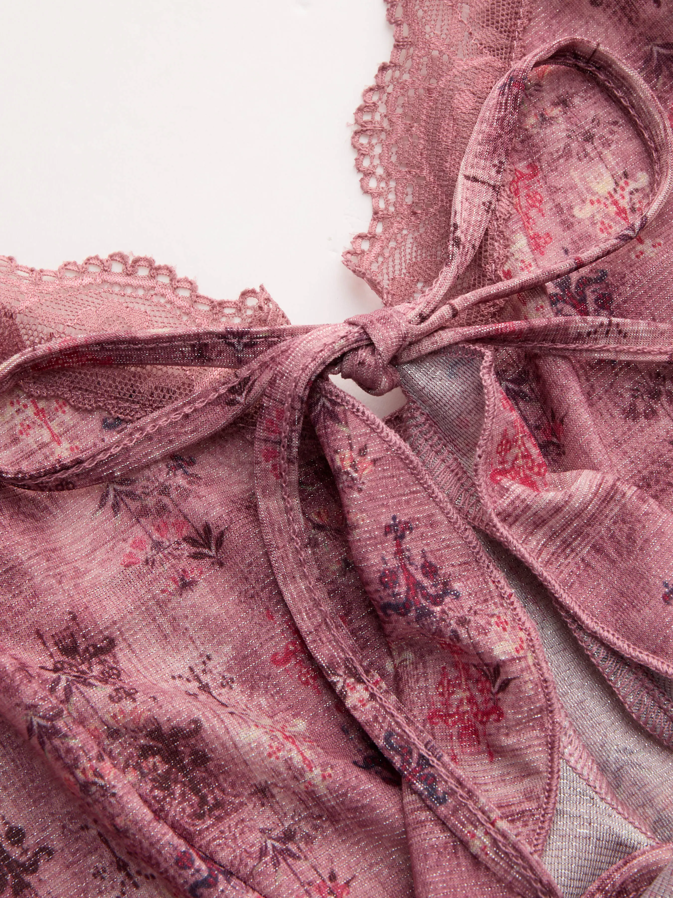 10809-v-neck-floral-tie-front-bow-lace-ruffle-hem-crop-cami-top-1.webp