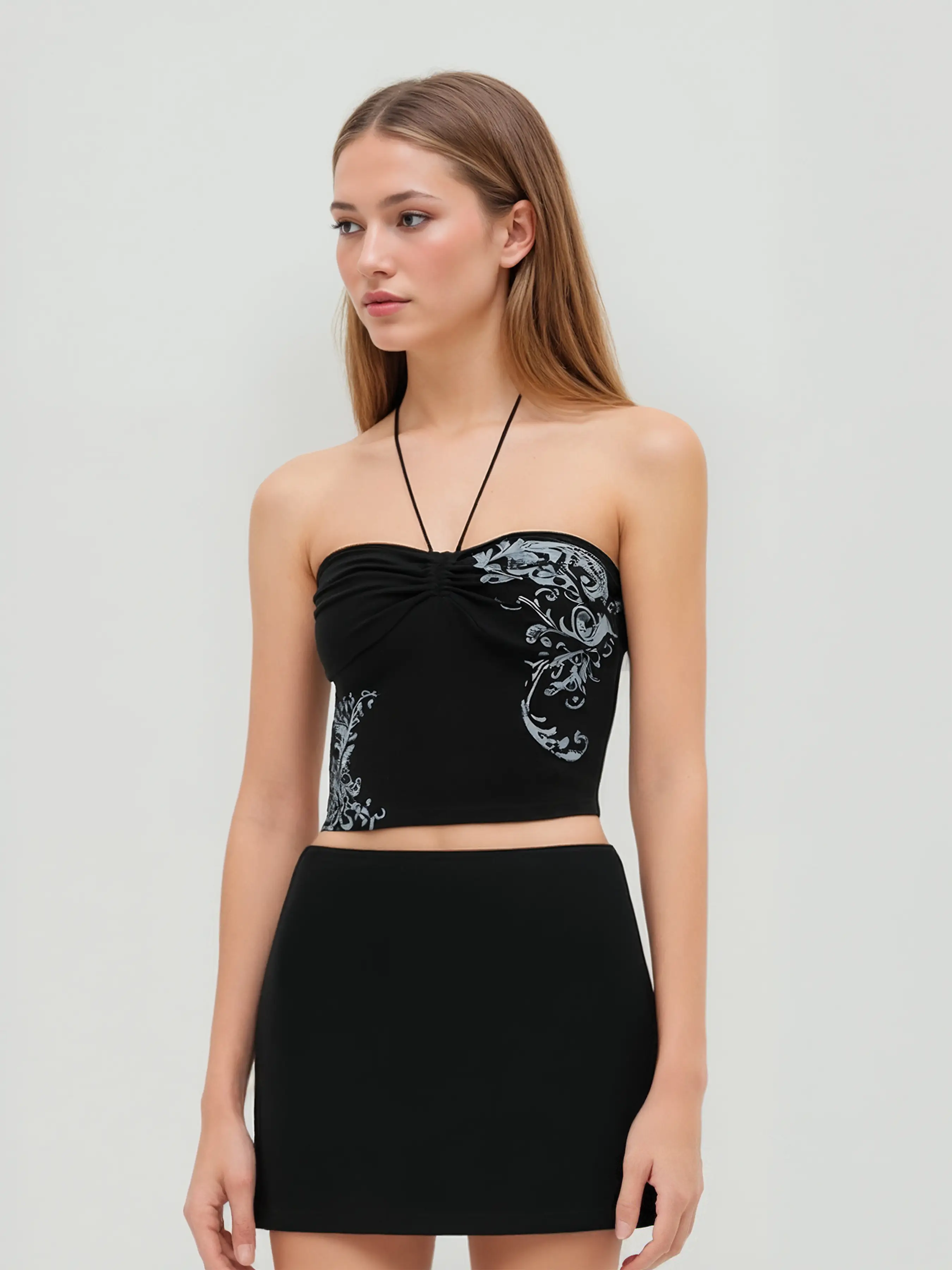 11420-halter-neckline-graphic-beaded-knotted-crop-top-1.webp
