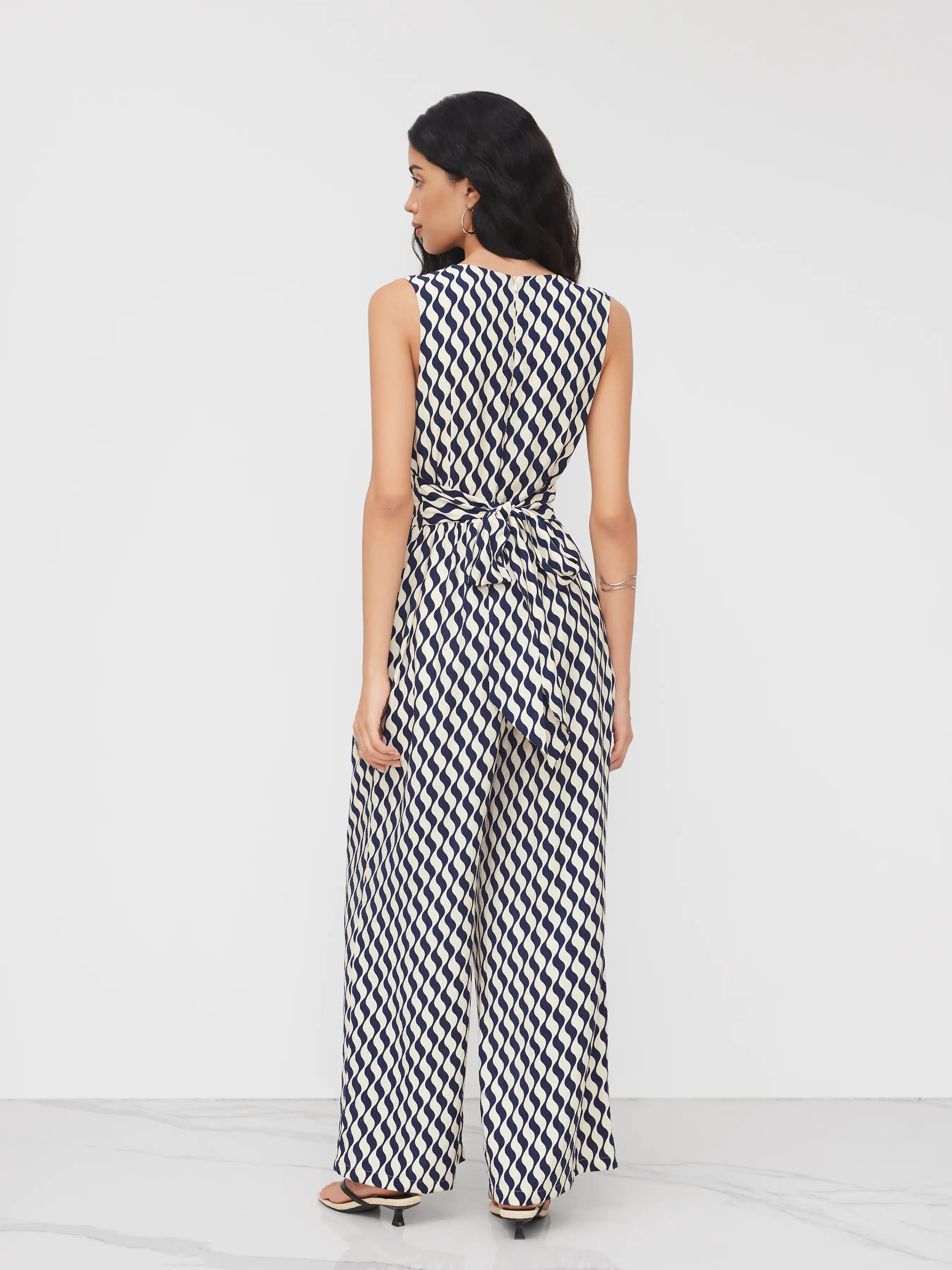 13538-v-neck-abstract-knotted-back-wide-leg-jumpsuit-1.webp