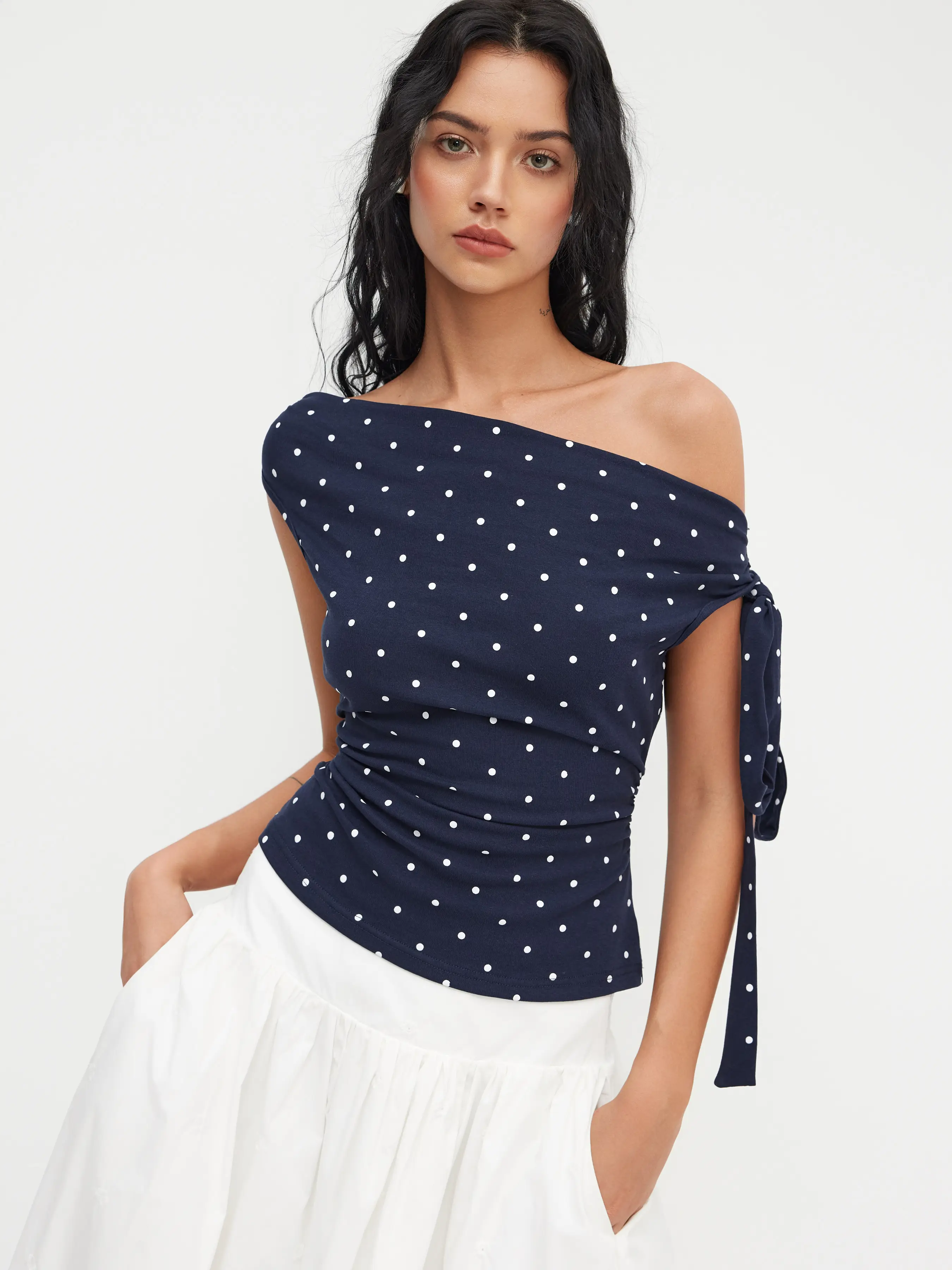 Cotton-blend Asymmetrical Neck Polka Dot Ruched Knotted Top