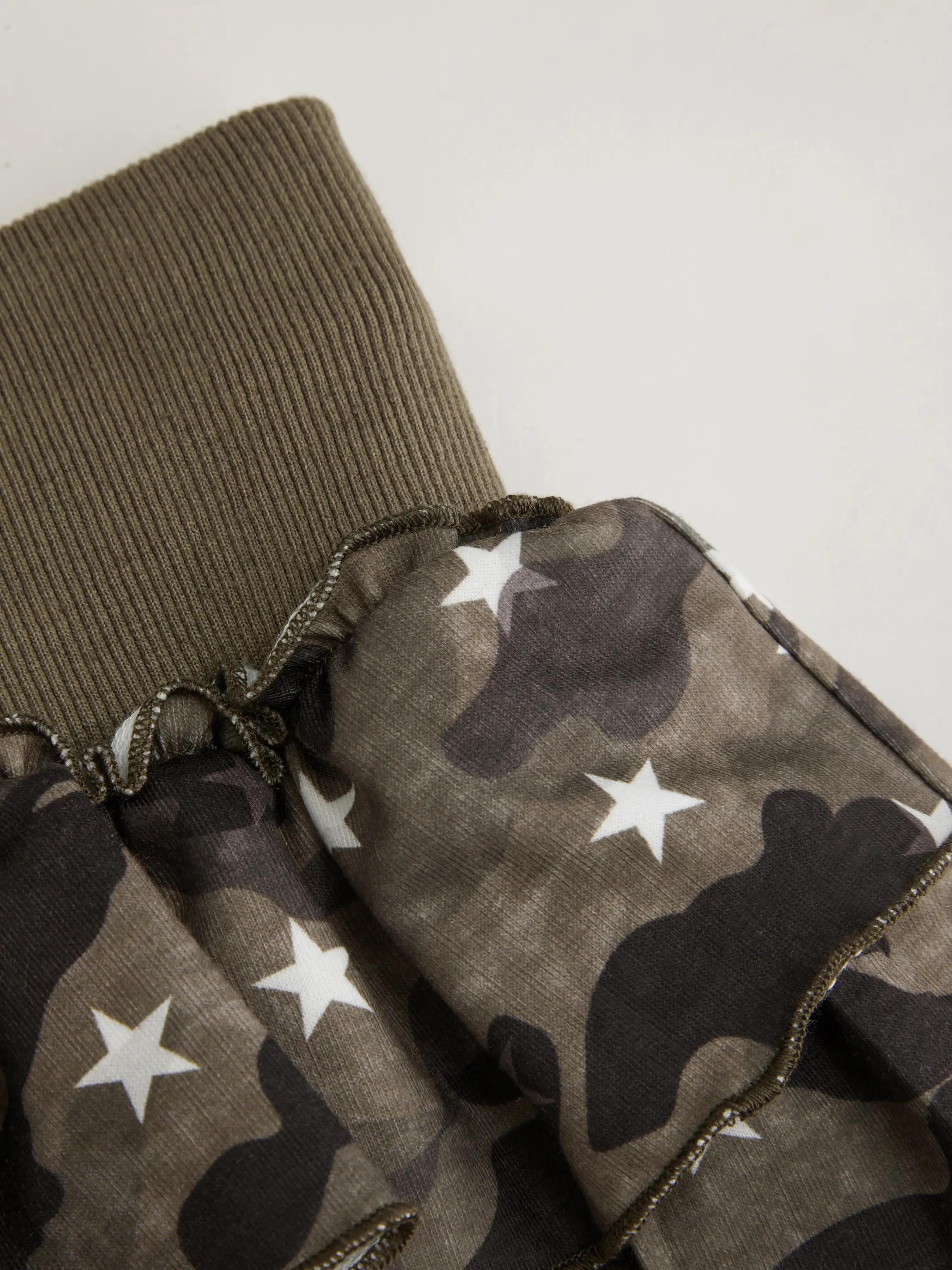 3150-jersey-mid-rise-camo-drawstring-rara-mini-skirt-1.webp