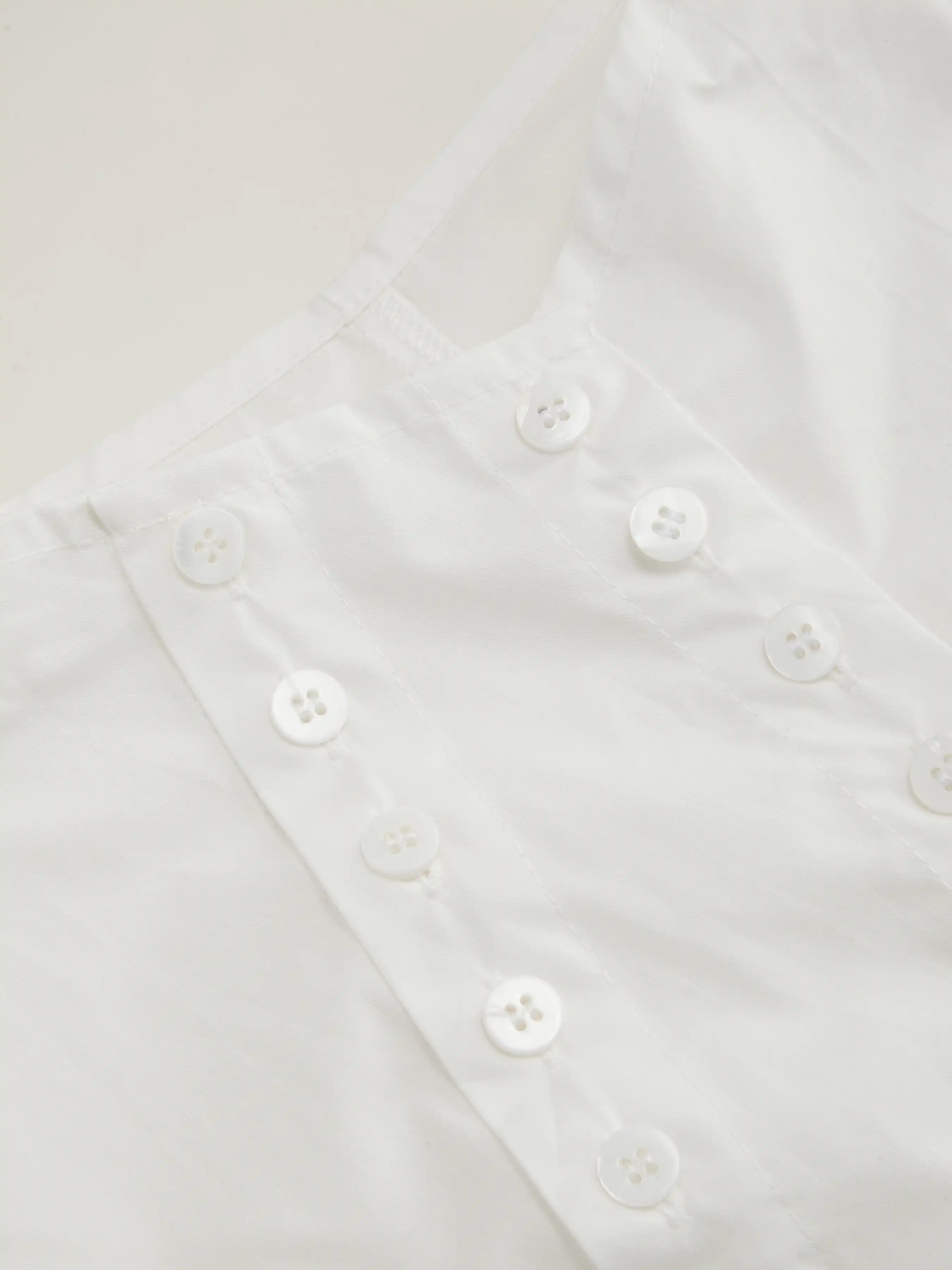 5045-100-cotton-asymmetrical-neck-button-curved-hem-short-sleeve-blouse-1.jpg
