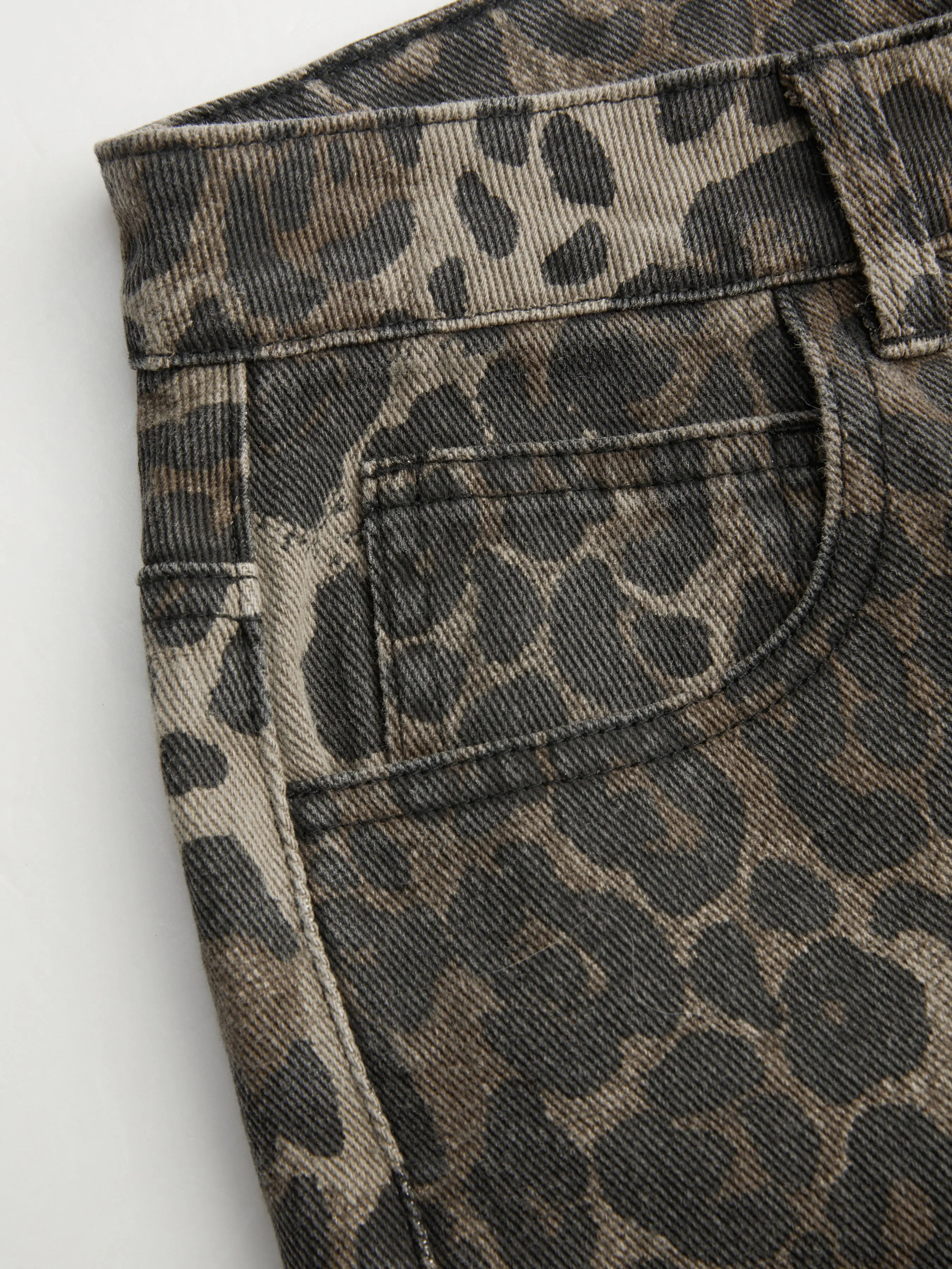 5601-cider-denim-mid-rise-leopard-barrel-leg-jeans-1.webp