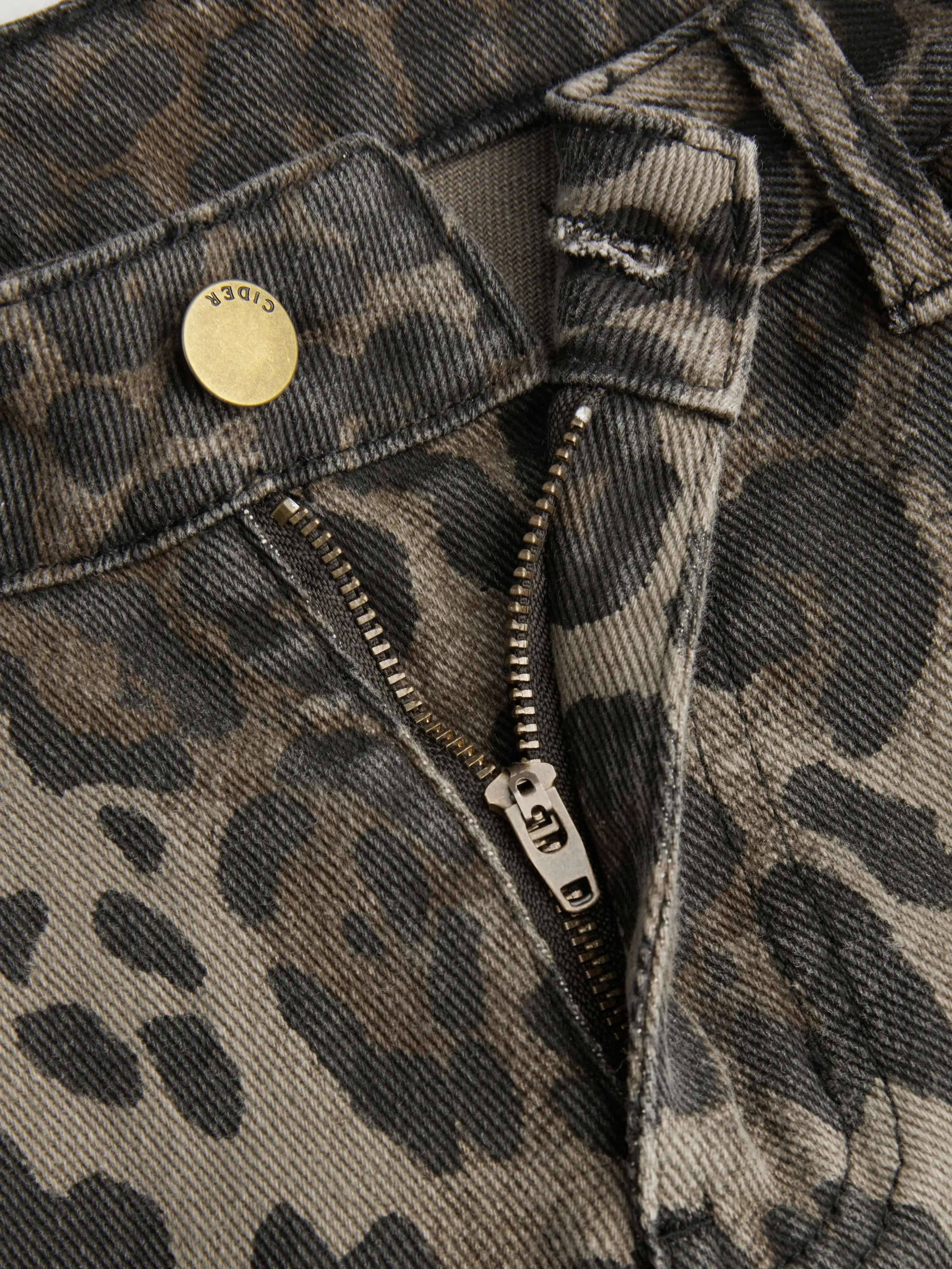 5601-cider-denim-mid-rise-leopard-barrel-leg-jeans-1.webp