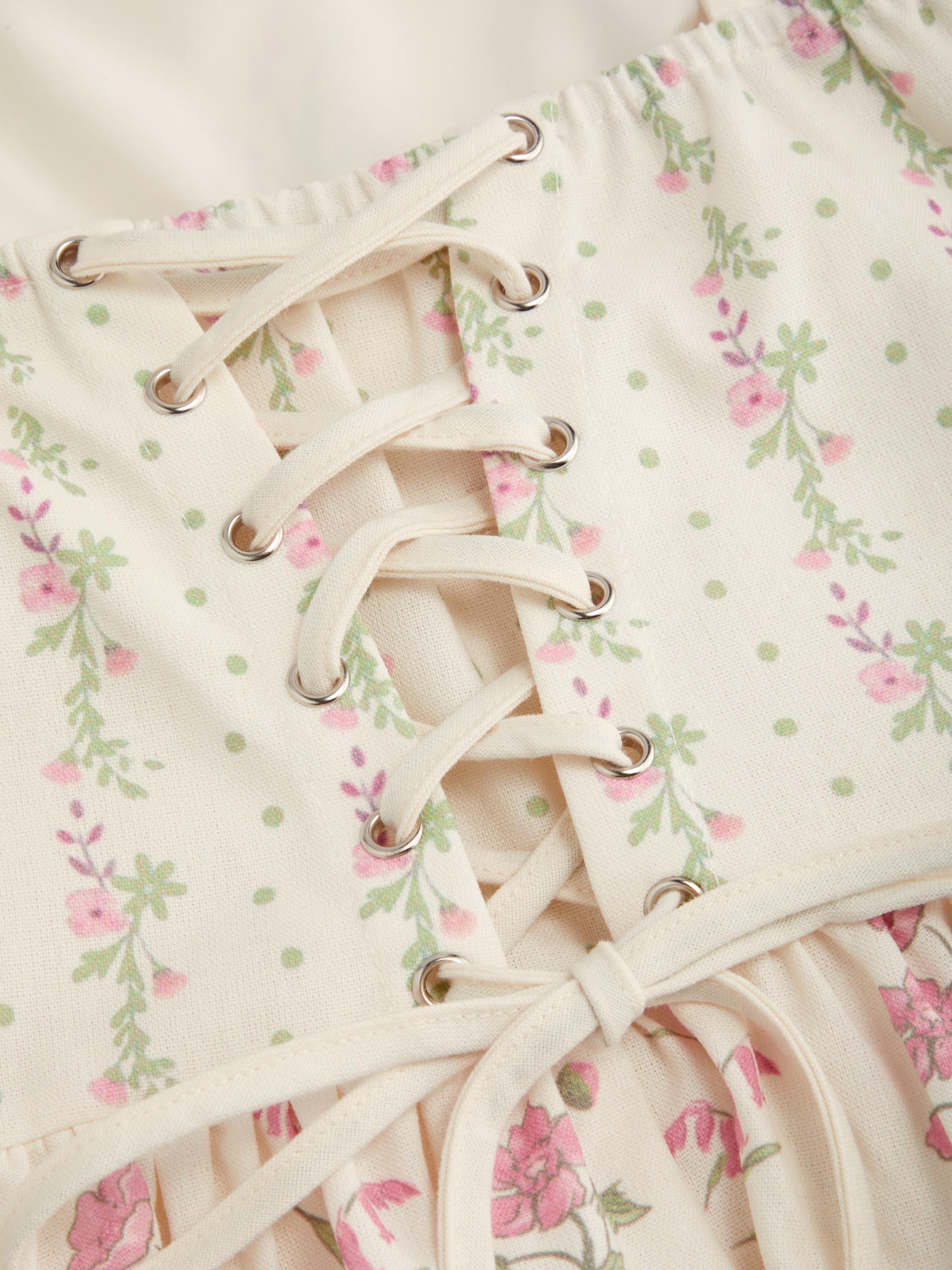 5916-linen-blend-floral-broderie-anglaise-trim-layered-lace-up-mini-dress-1.webp