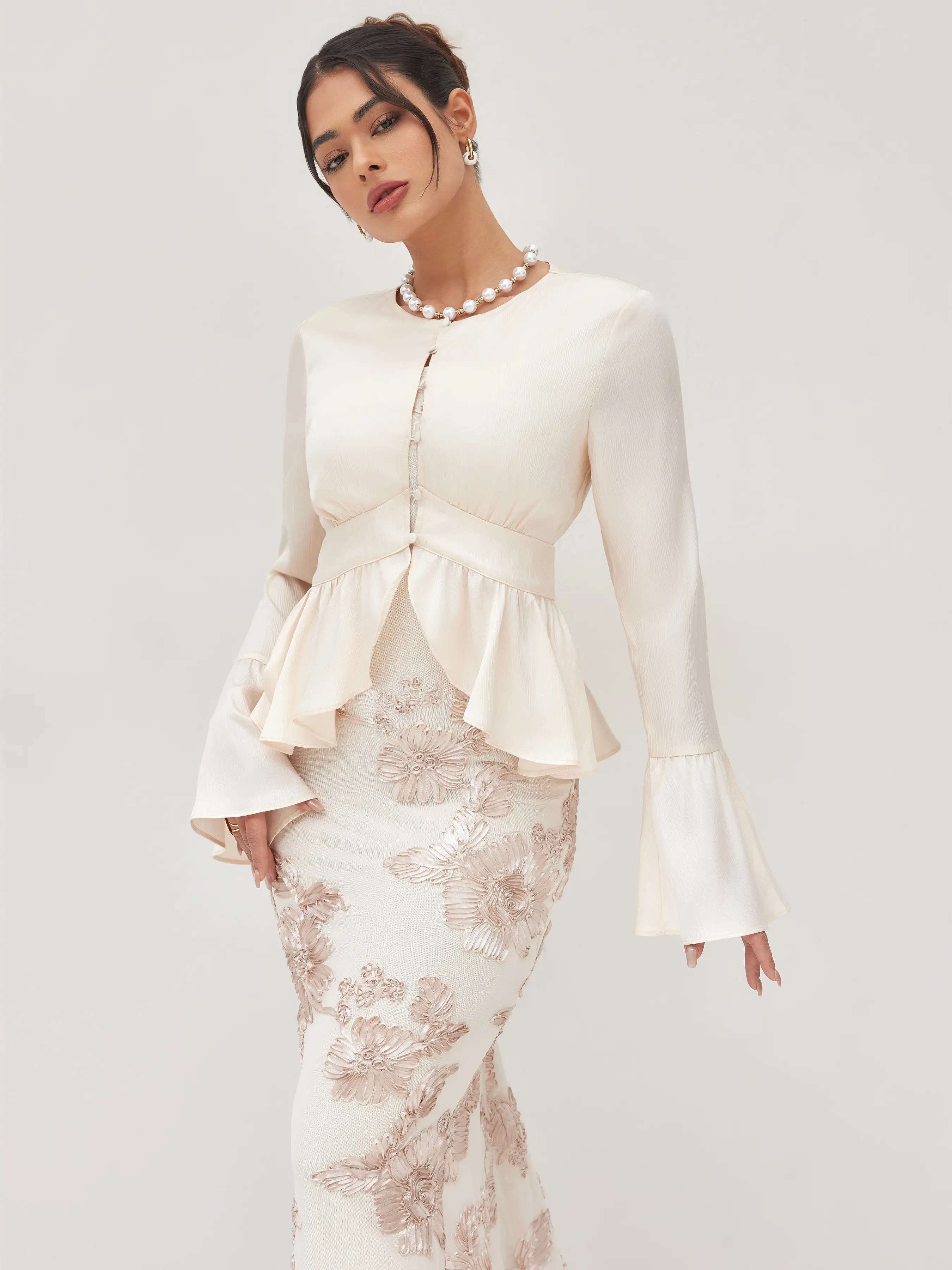 6179-round-neckline-ruffle-hem-blouse-1.webp