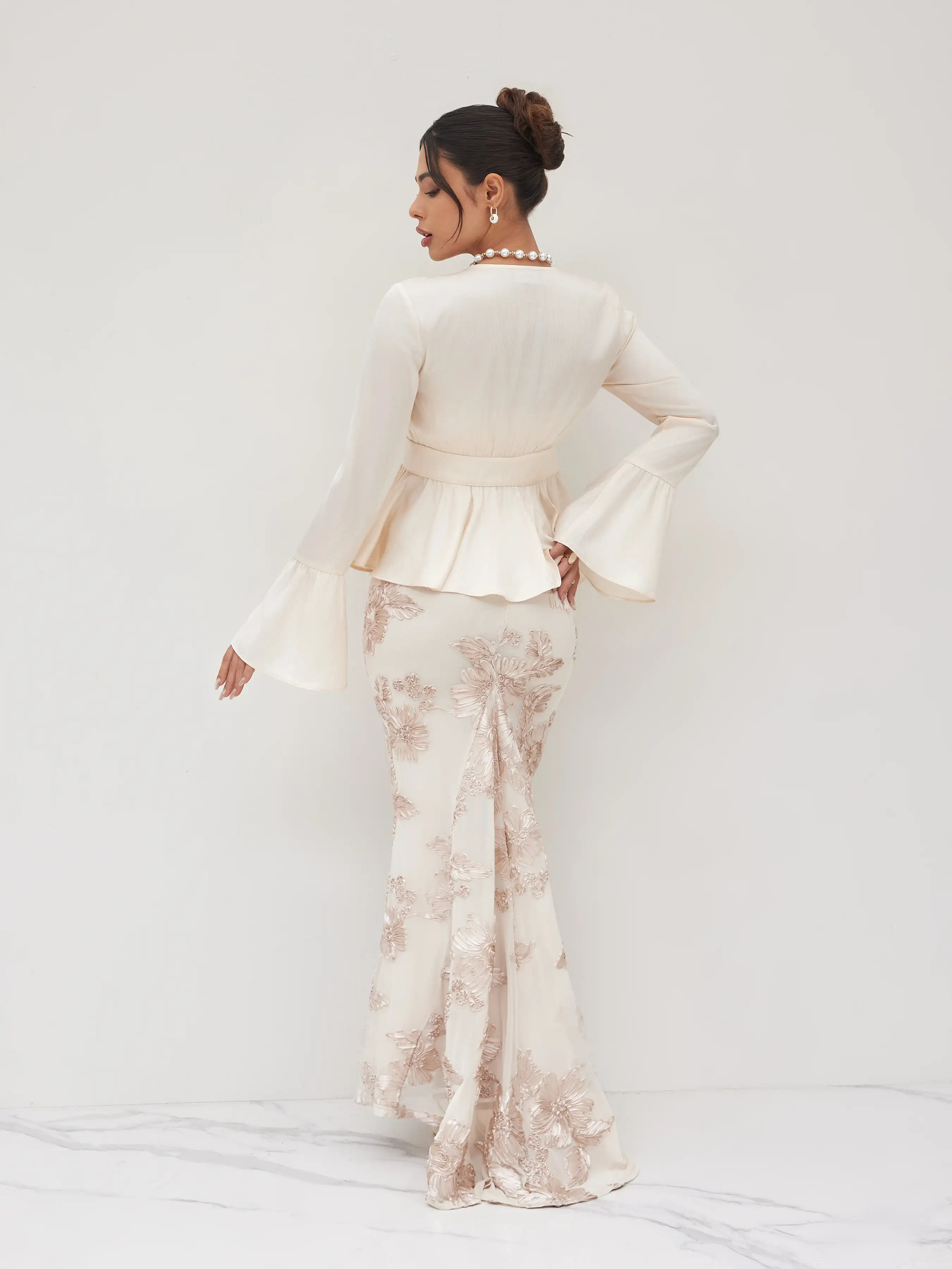 6179-round-neckline-ruffle-hem-blouse-1.webp