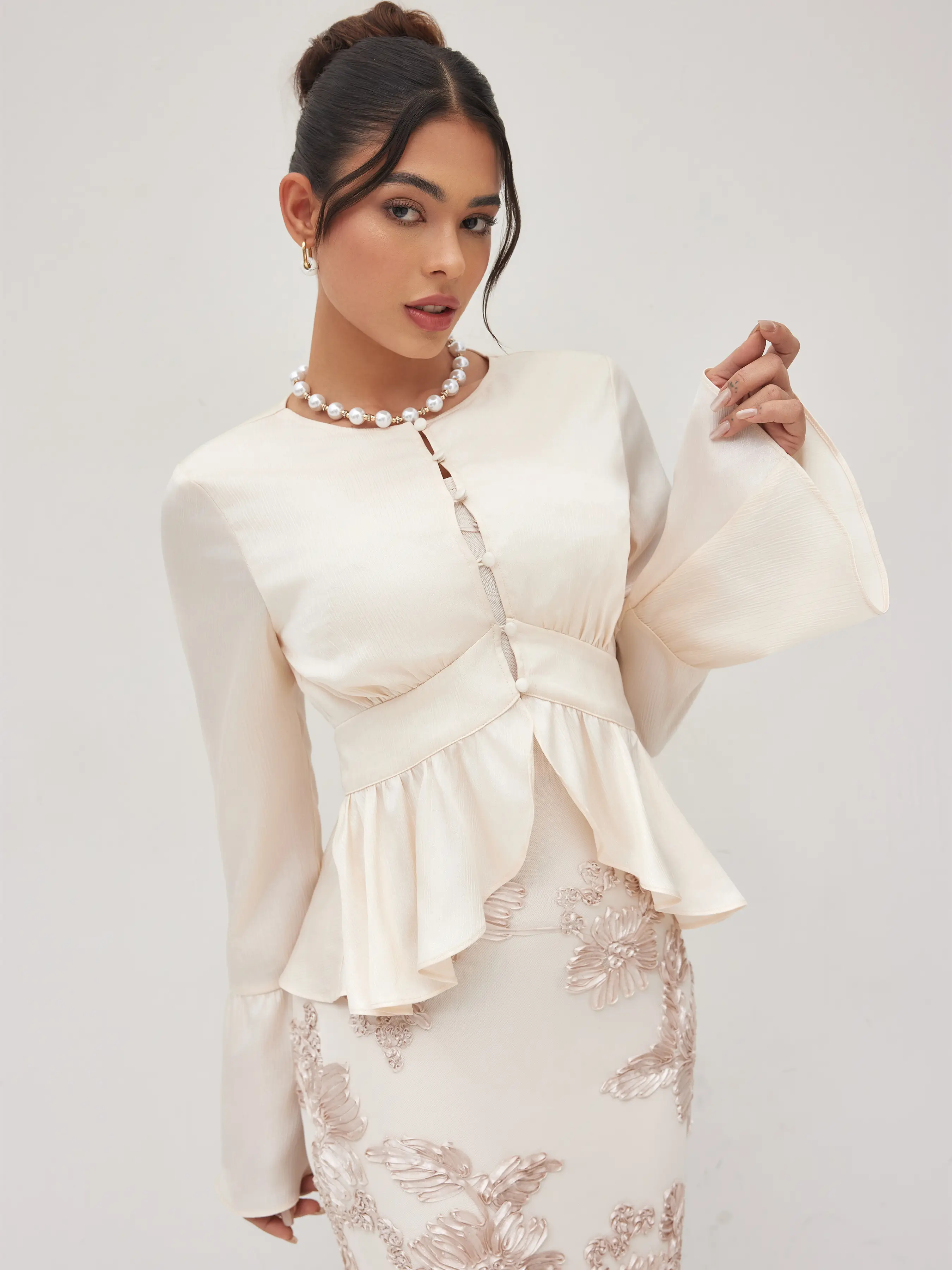 6179-round-neckline-ruffle-hem-blouse-1.webp