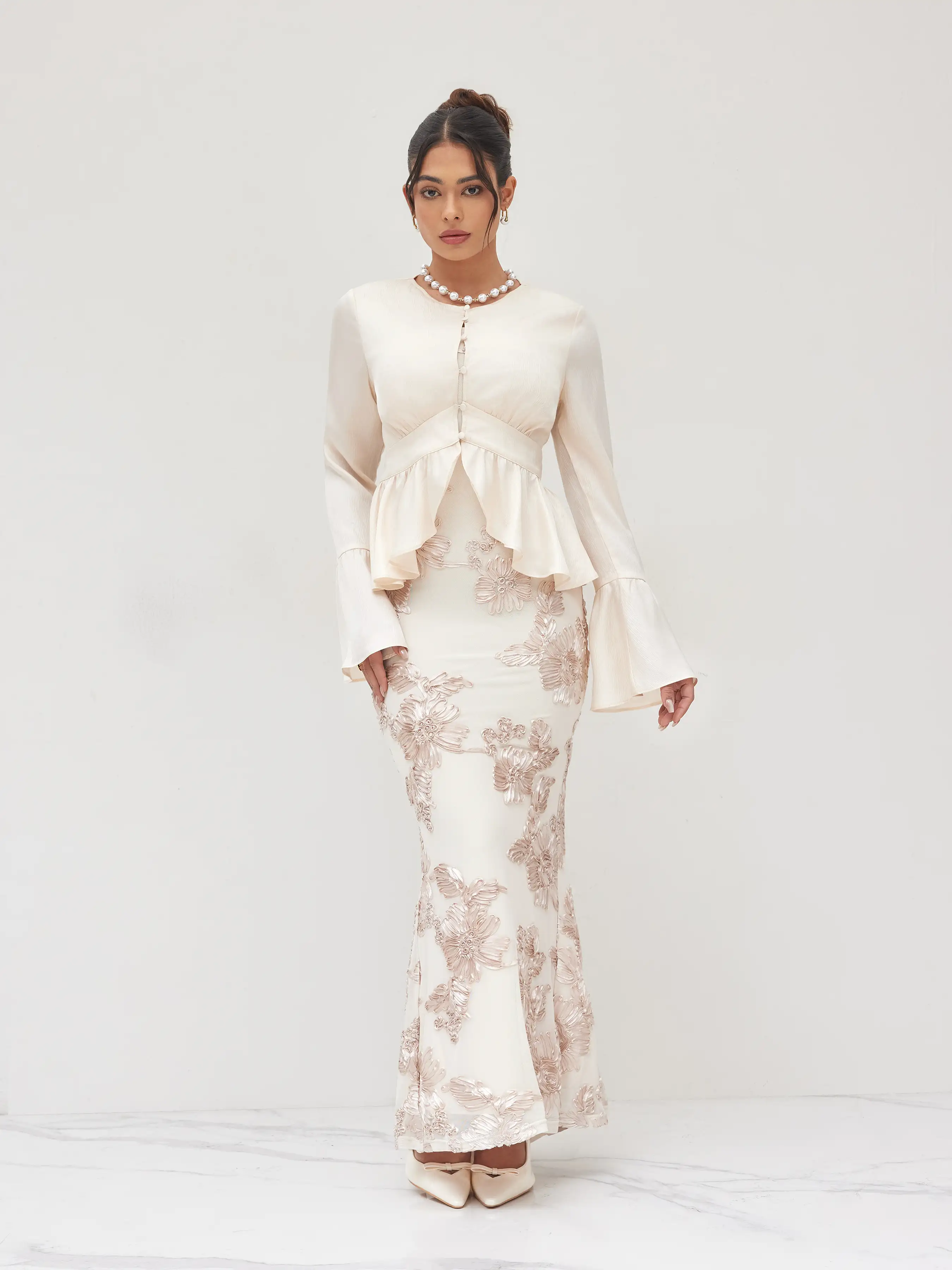 6179-round-neckline-ruffle-hem-blouse-1.webp