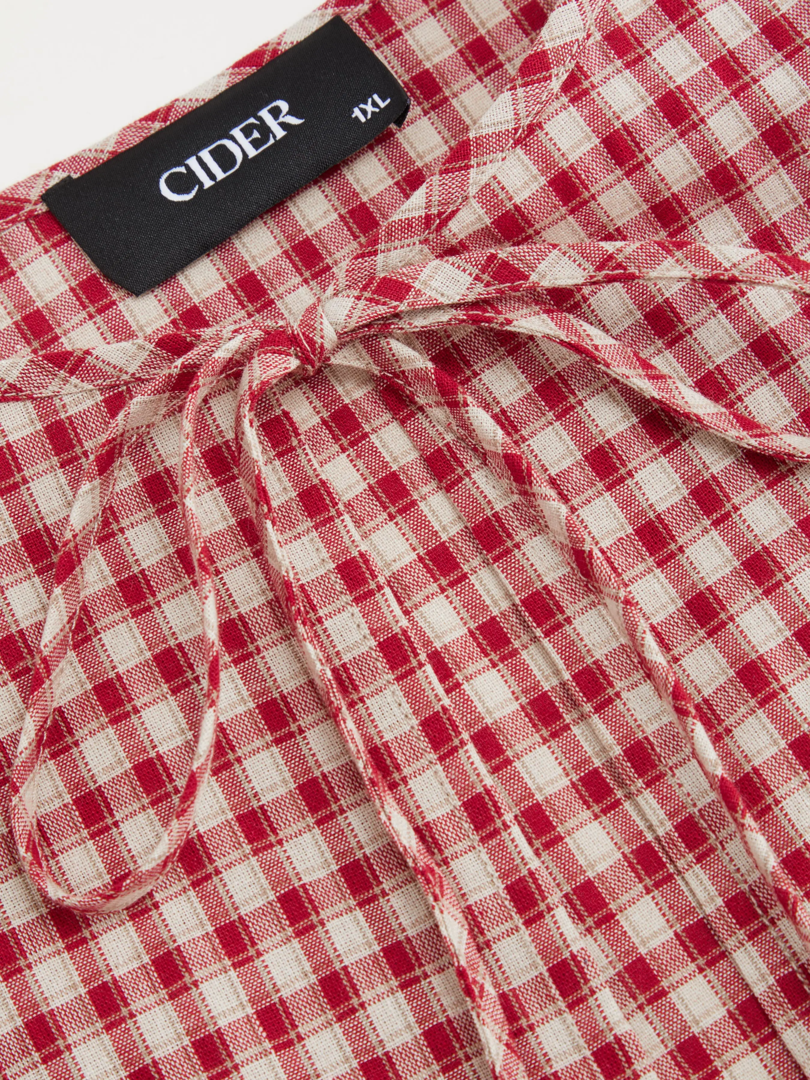 7140-100-cotton-round-neckline-gingham-tie-front-ruffle-hem-long-sleeve-blouse-curve-plus-1.webp