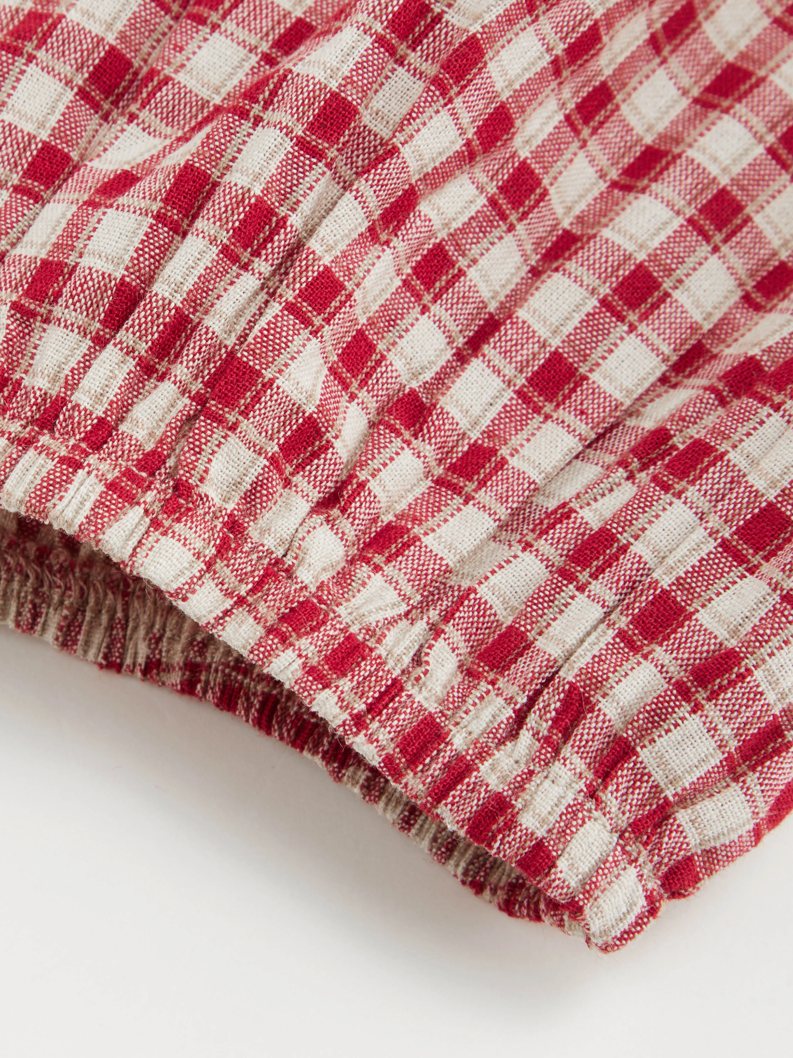7140-100-cotton-round-neckline-gingham-tie-front-ruffle-hem-long-sleeve-blouse-curve-plus-1.webp