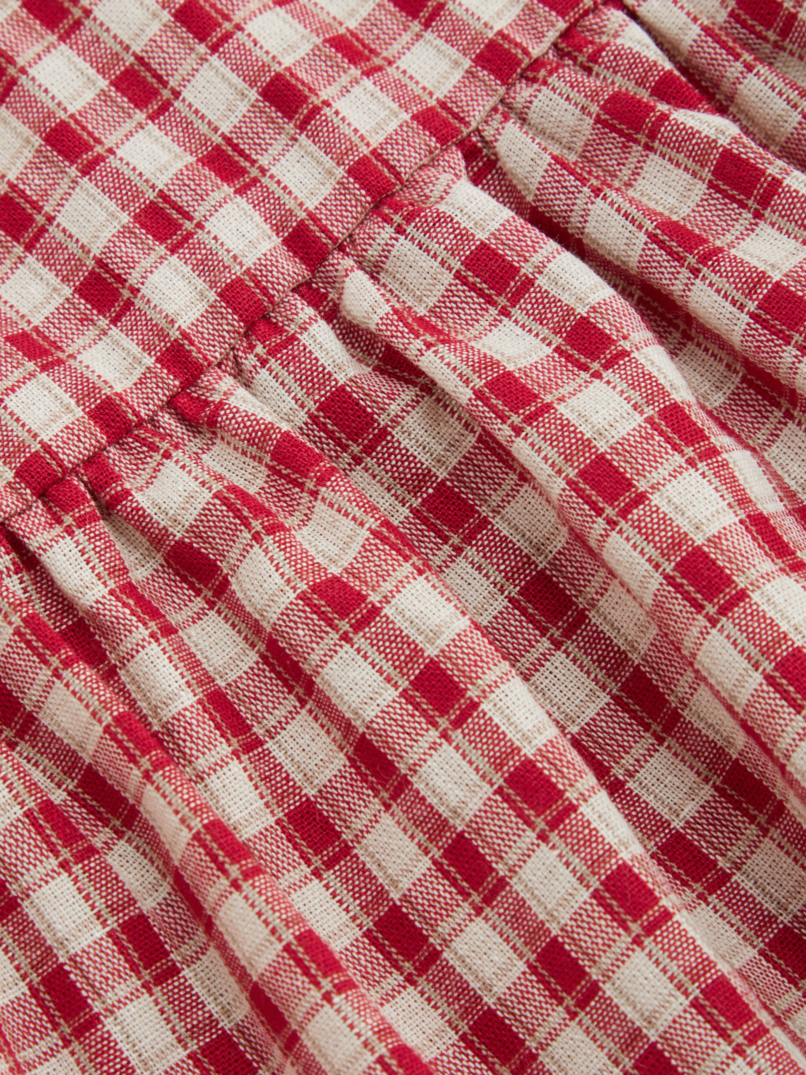 7140-100-cotton-round-neckline-gingham-tie-front-ruffle-hem-long-sleeve-blouse-curve-plus-1.webp