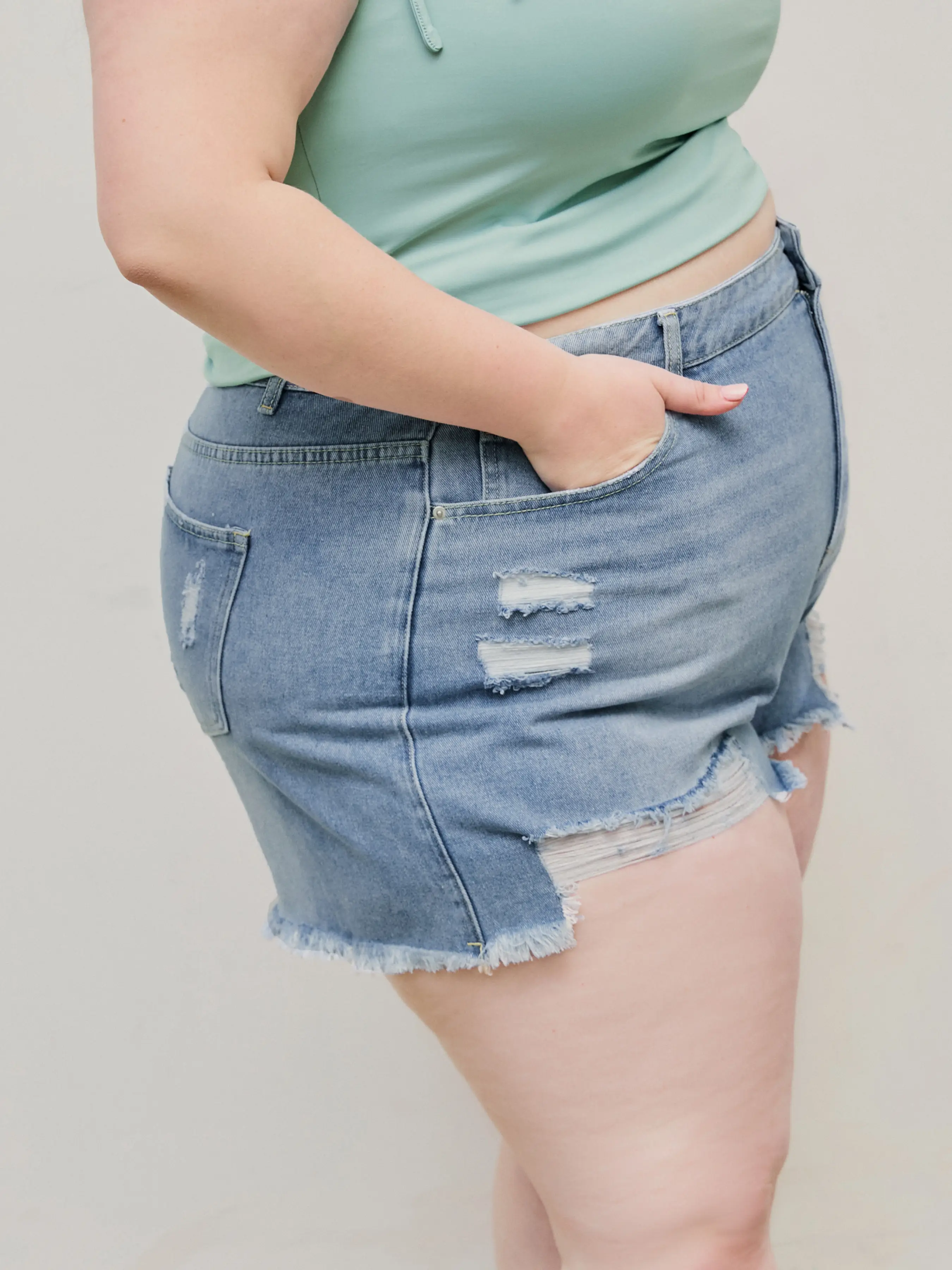 7493-tassels-ripped-pocket-jean-shorts-curve-plus-1.webp