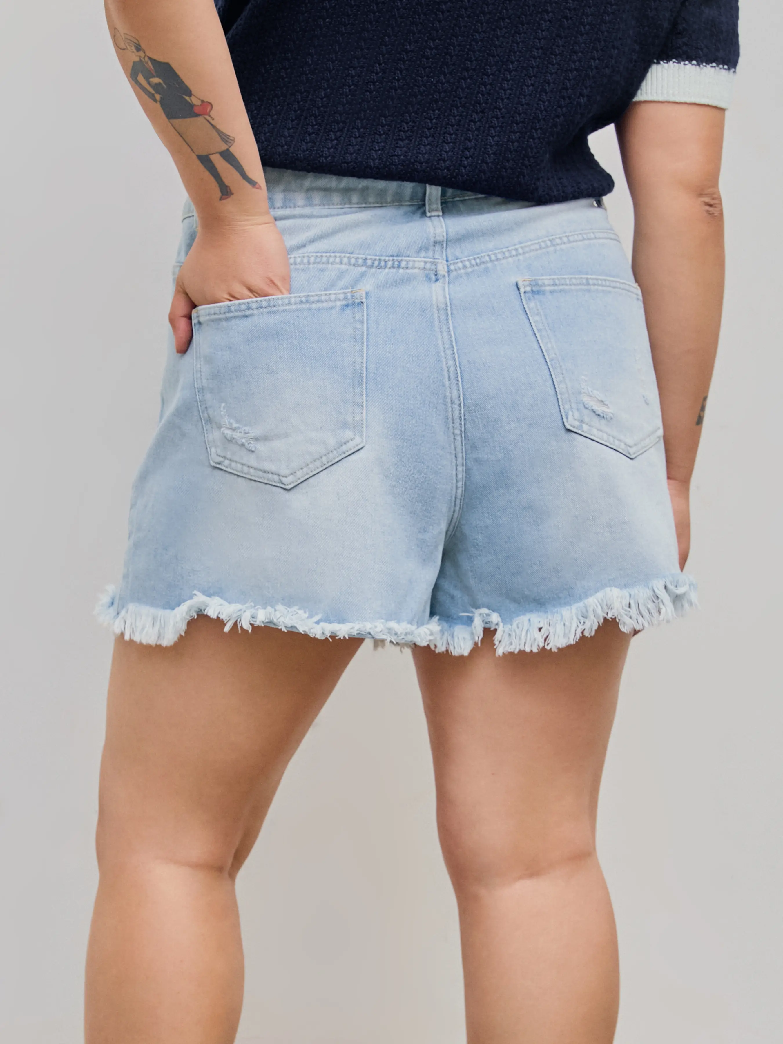 7493-tassels-ripped-pocket-jean-shorts-curve-plus-1.webp