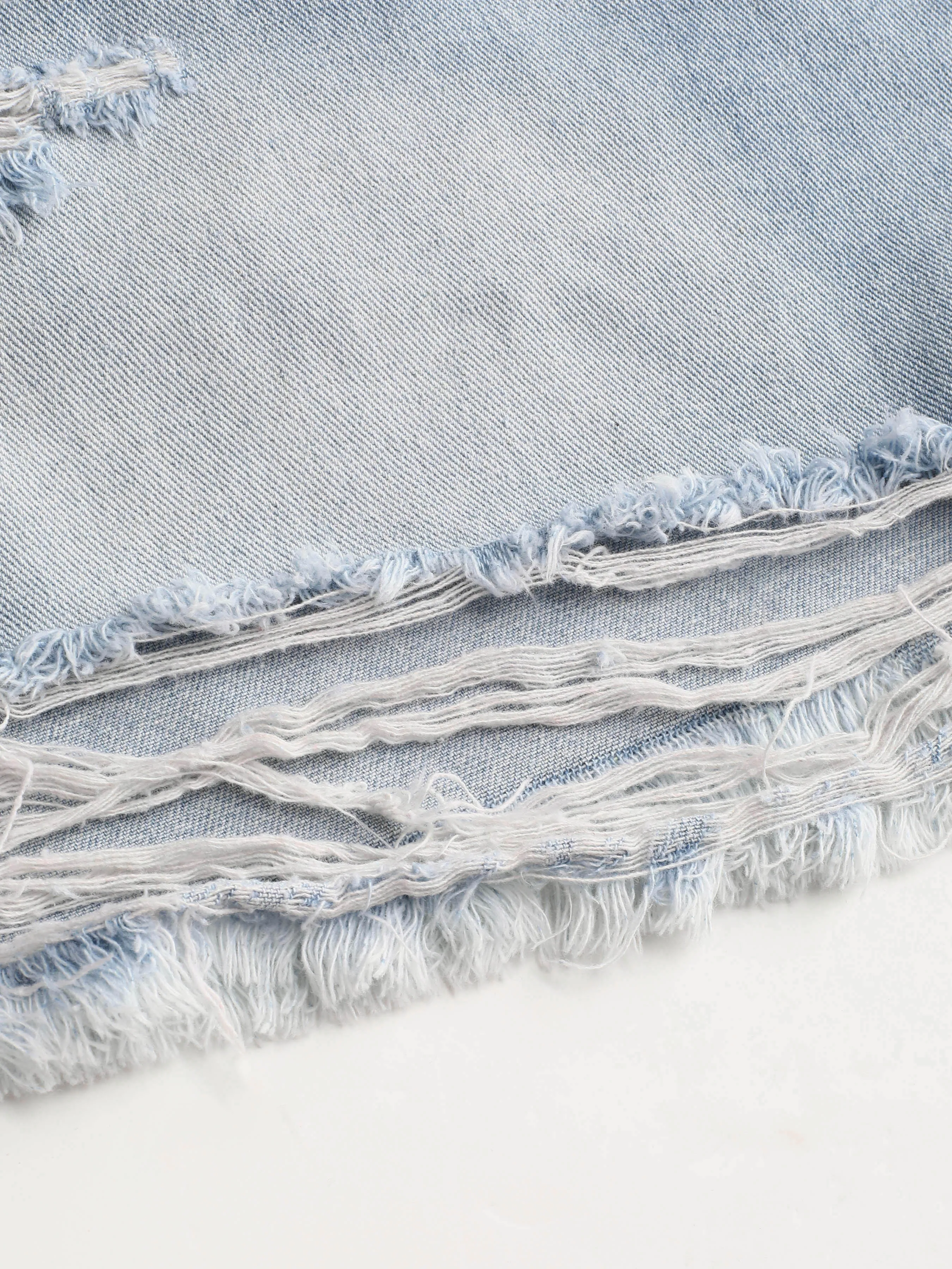 7493-tassels-ripped-pocket-jean-shorts-curve-plus-1.webp