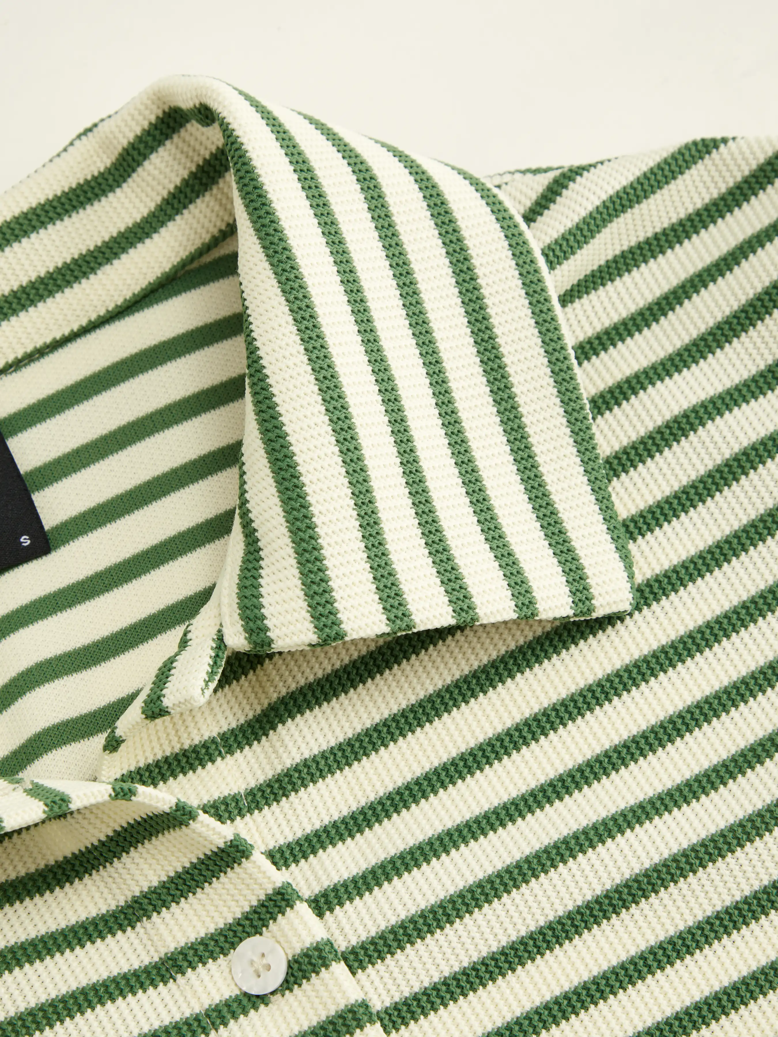 7626-polo-collar-stripe-button-through-tee-1.webp